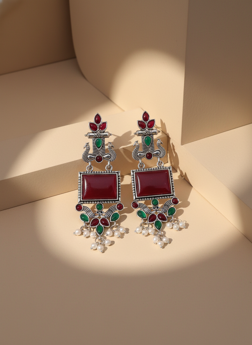 Exquisite Oxidized Silver Peacock Dangle Earrings with Maroon Stones