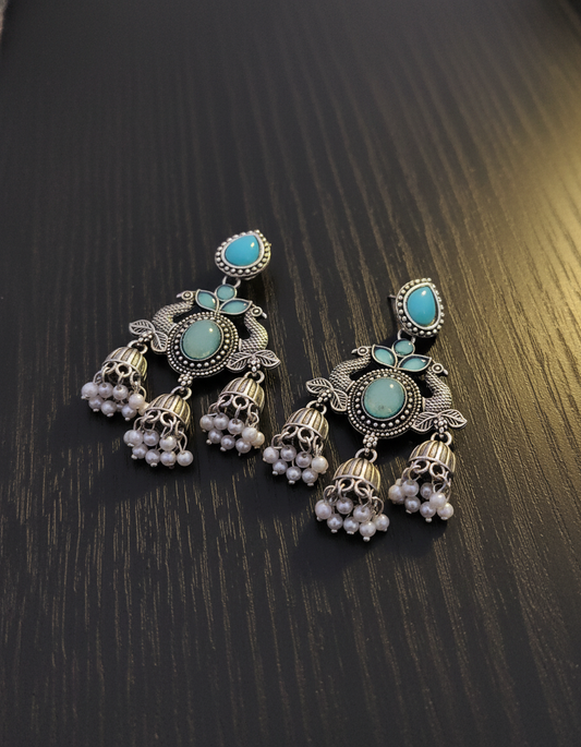 Exquisite Oxidized Silver Peacock Jhumka Earrings with Turquoise & Pearl Accents
