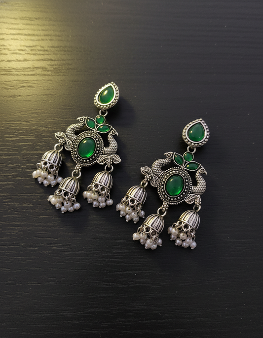Exquisite Oxidized Silver Peacock Jhumka Earrings with Green Gemstones