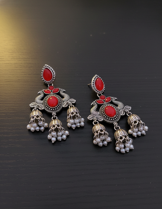 Stunning Oxidized Silver Peacock Jhumka Earrings with Red Stones and Pearl Drops