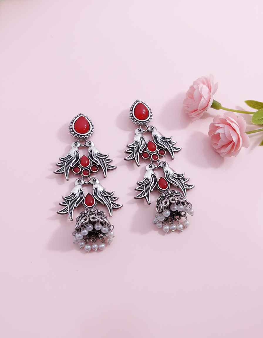 Exquisite Oxidized Silver Jhumka Earrings with Red Stone Bird Motif
