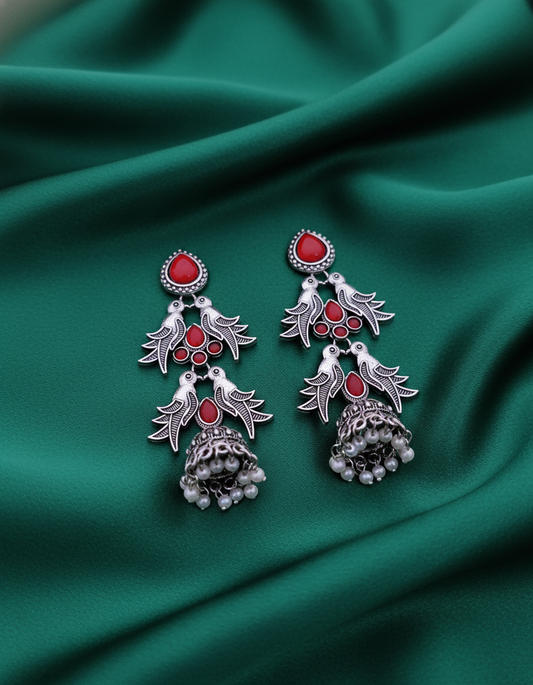Exquisite Oxidized Silver Jhumka Earrings with Red Stone Bird Motif