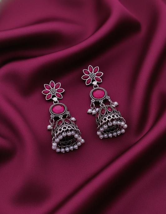 Stunning Oxidized Silver Jhumka Earrings with Vibrant Rani Pink Stones and Pearl Accents)
