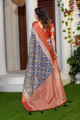 Indigo Radiance: Elegant Patola Print Art Silk Saree with Zari Border