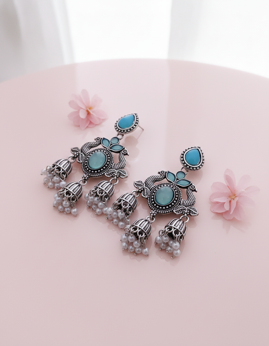 Exquisite Oxidized Silver Peacock Jhumka Earrings with Turquoise & Pearl Accents