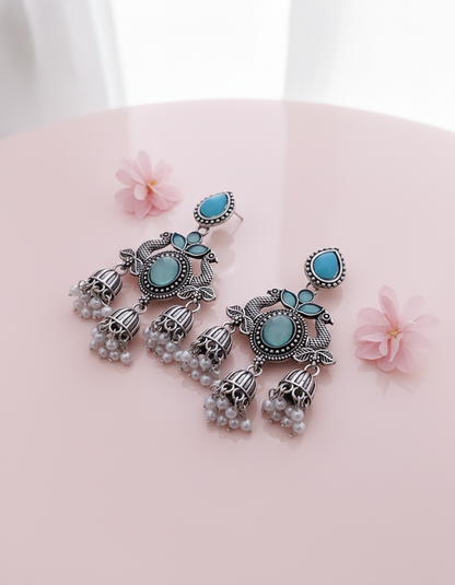 Exquisite Oxidized Silver Peacock Jhumka Earrings with Turquoise & Pearl Accents