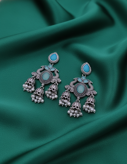 Exquisite Oxidized Silver Peacock Jhumka Earrings with Turquoise & Pearl Accents