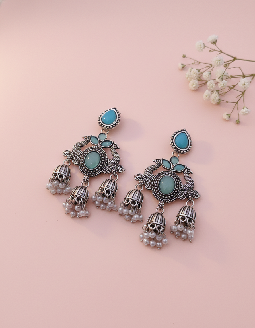 Exquisite Oxidized Silver Peacock Jhumka Earrings with Turquoise & Pearl Accents