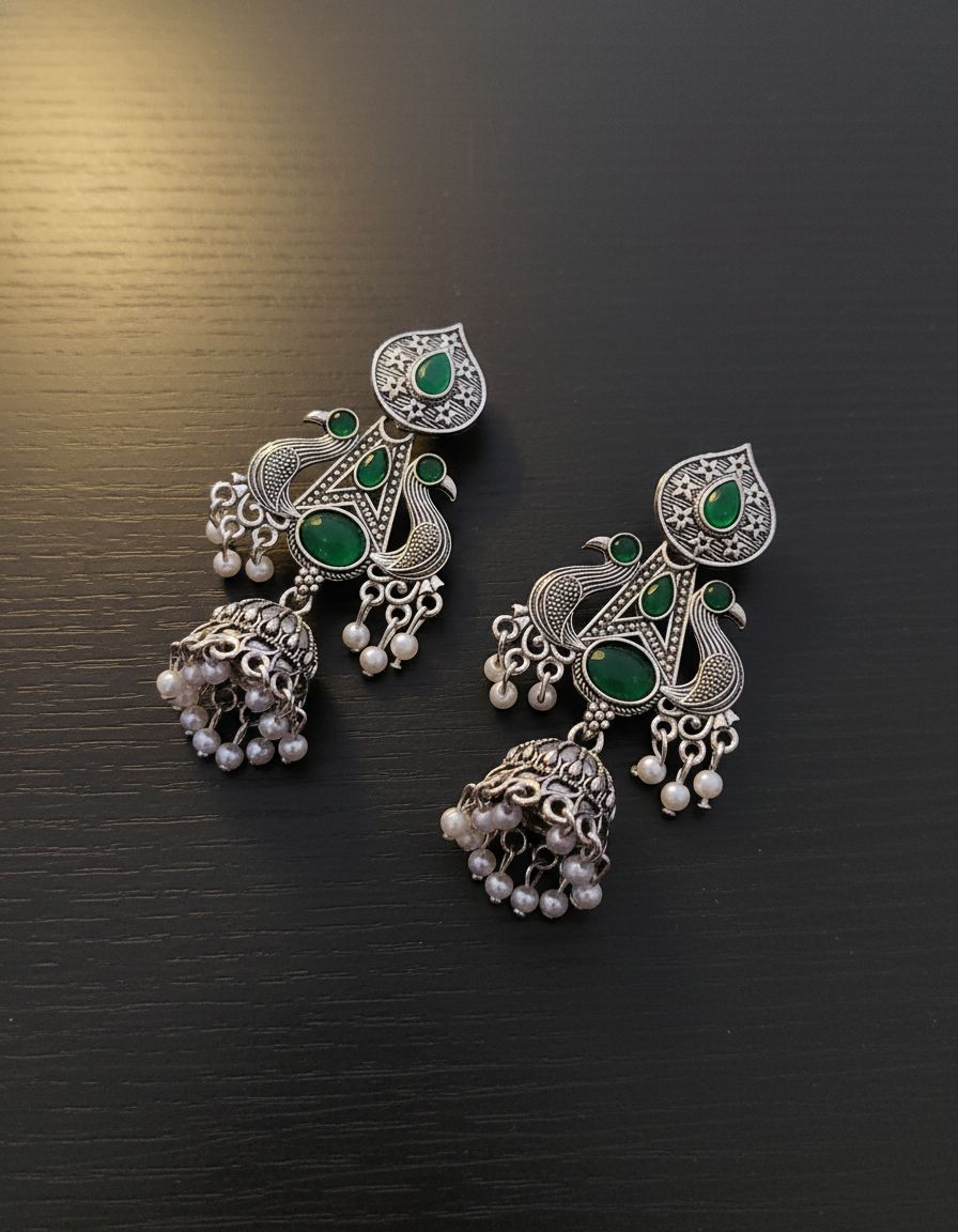 Exquisite Oxidized Silver Peacock Jhumkas with Emerald Green Stones