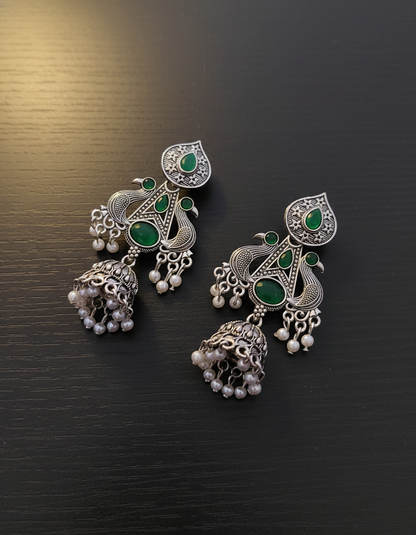 Exquisite Oxidized Silver Peacock Jhumkas with Emerald Green Stones