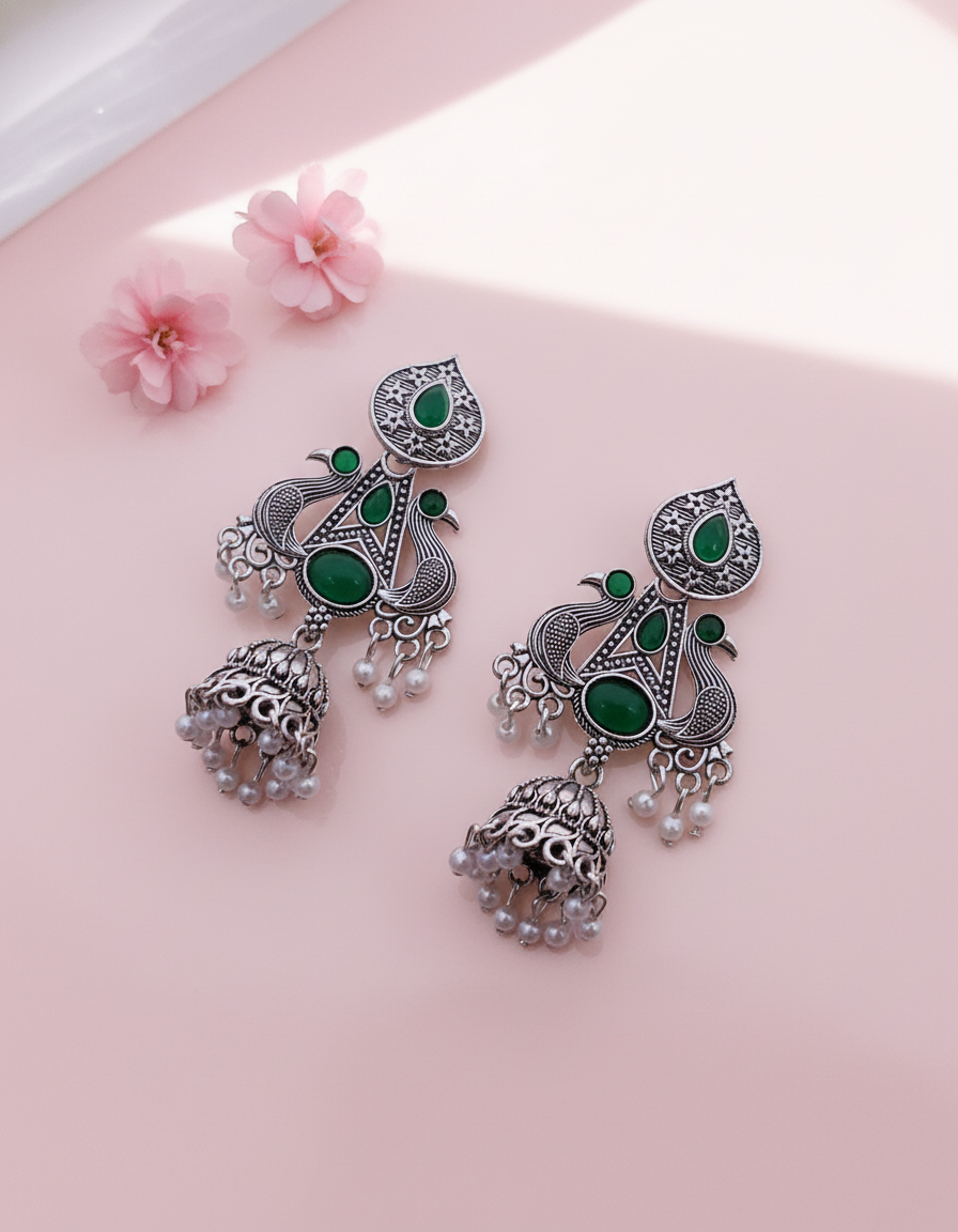 Exquisite Oxidized Silver Peacock Jhumkas with Emerald Green Stones