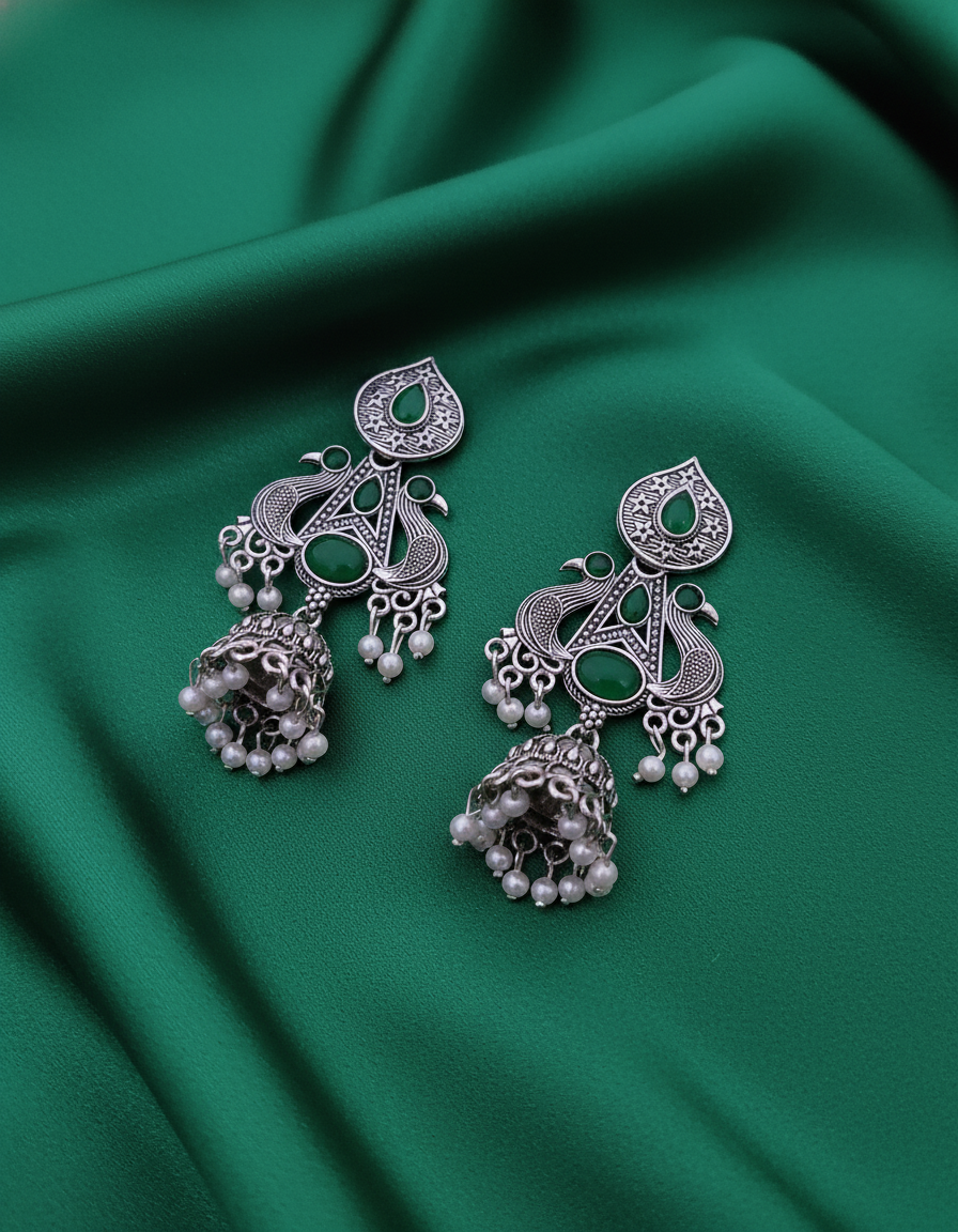 Exquisite Oxidized Silver Peacock Jhumkas with Emerald Green Stones