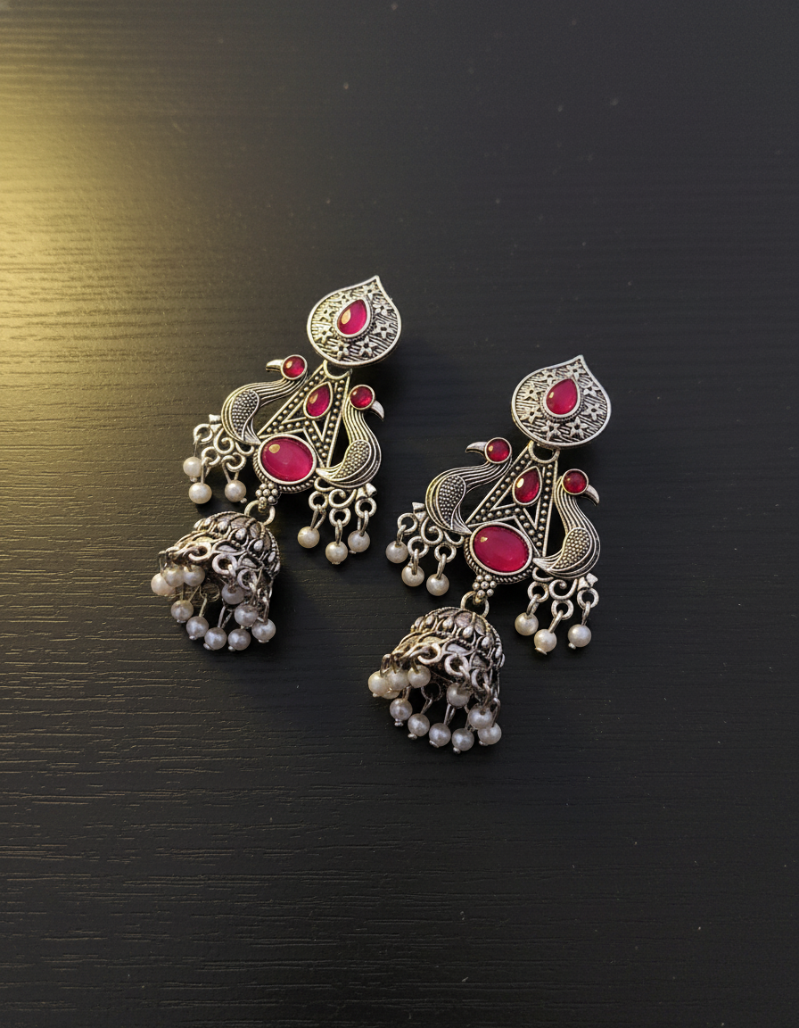 Exquisite Oxidized Silver Peacock Jhumka Earrings with Pink Gems