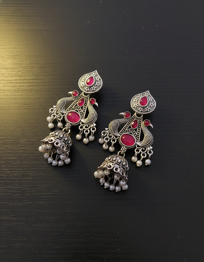 Exquisite Oxidized Silver Peacock Jhumka Earrings with Pink Gems