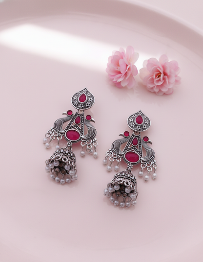 Exquisite Oxidized Silver Peacock Jhumka Earrings with Pink Gems