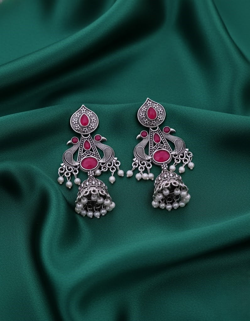 Exquisite Oxidized Silver Peacock Jhumka Earrings with Pink Gems