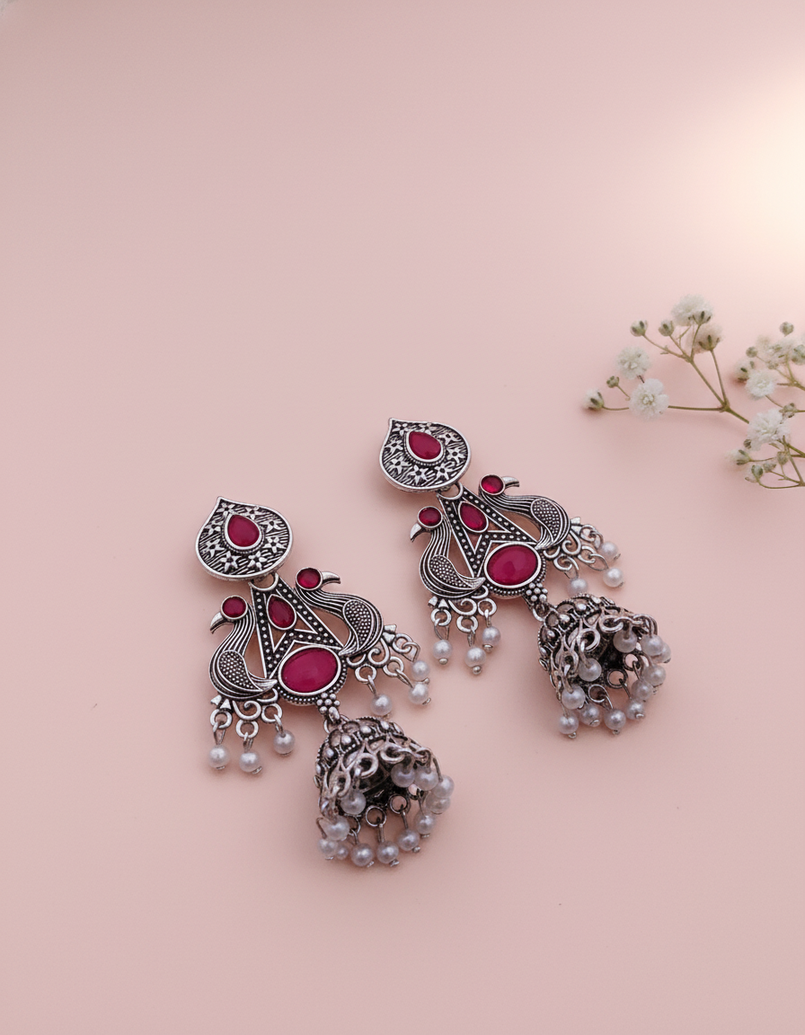 Exquisite Oxidized Silver Peacock Jhumka Earrings with Pink Gems