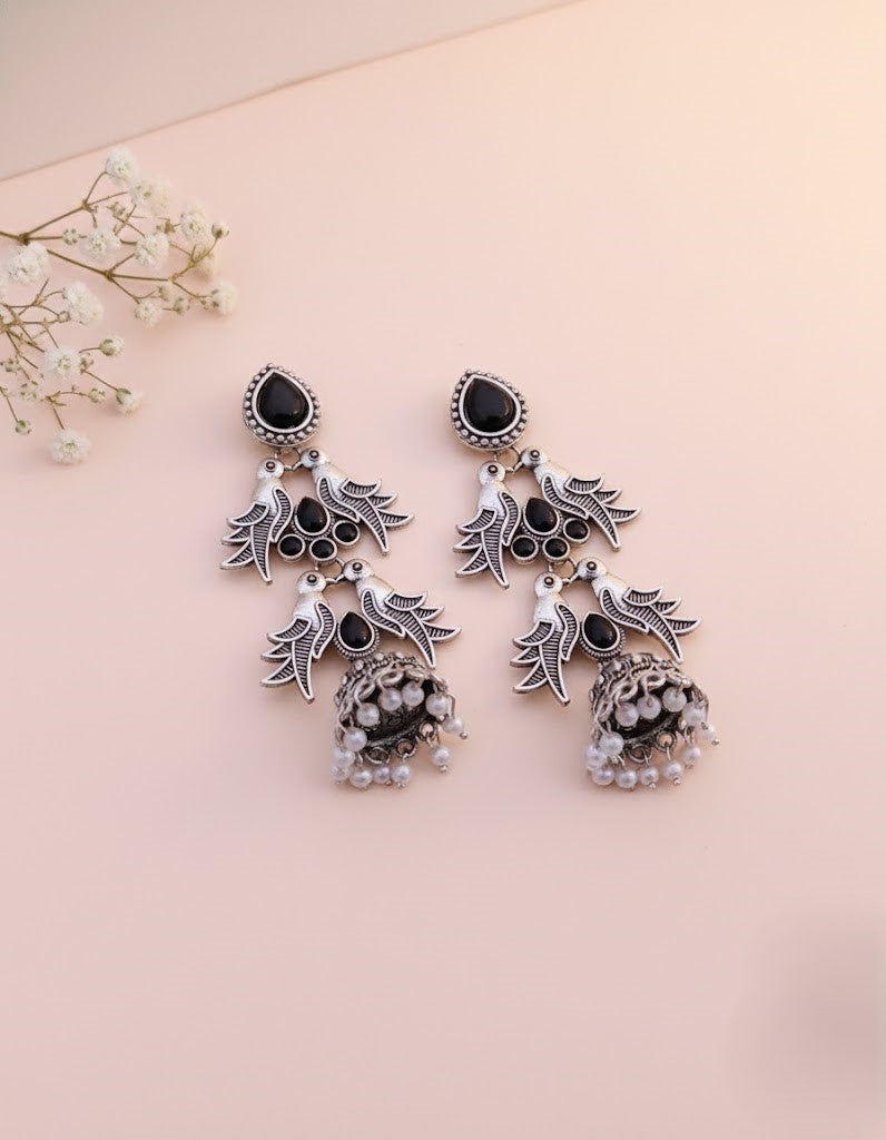Elegant Oxidised Silver Peacock Jhumka Earrings with Black Stones and Pearls