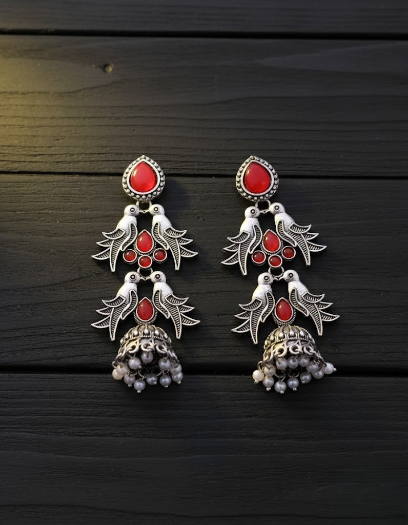 Exquisite Oxidized Silver Jhumka Earrings with Red Stone Bird Motif