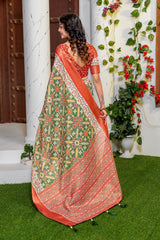 Vibrant Green Patola Silk Saree with Elegant Zari Border